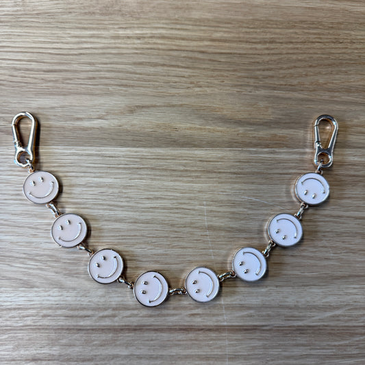 Tassenhanger Smiley Beige